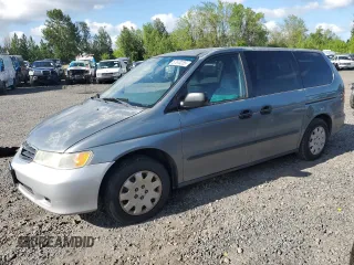 2001 Honda Odyssey LX with VIN 2HKRL18531H540774, listed as a Copart auction lot 57670255 with 209,379 mi miles and Salvage title. Bid and sale history available at DreamBid. Image 1.