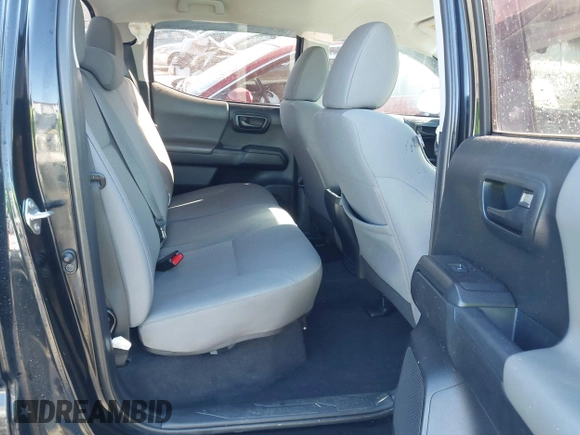 2018 Toyota Tacoma SR with VIN 5TFCZ5ANXJX124991, listed as a IAAI auction lot 41136867 with 57,980 mi miles and . Bid and sale history available at carsss.com. Image 8.