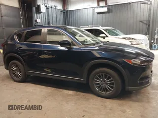 2020 Mazda CX-5 Touring with VIN JM3KFBCM5L0751284, listed as a IAAI auction lot 42157556 with 50,011 mi miles and . Bid and sale history available at DreamBid. Image 13.