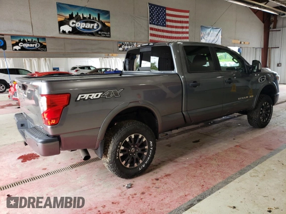 2016 Nissan Titan XD PRO-4X with VIN 1N6BA1F46GN501801, listed as a Copart auction lot 63231474 with 127,728 mi miles and Clean Title. Bid and sale history available at carsss.com. Image 3.