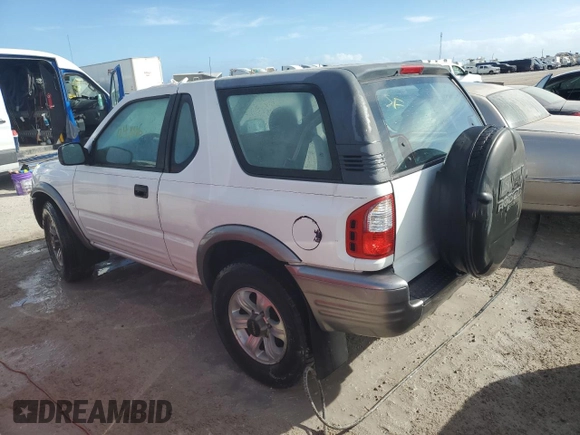 2001 Isuzu Rodeo z VIN 4S2CK57W614340766, wystawiony jako Copart lot #73891524 z przebiegiem 124 446 mil mil oraz Nie do naprawy. Historia ofert i sprzedaży dostępna na DreamBid. Obrazek 2.