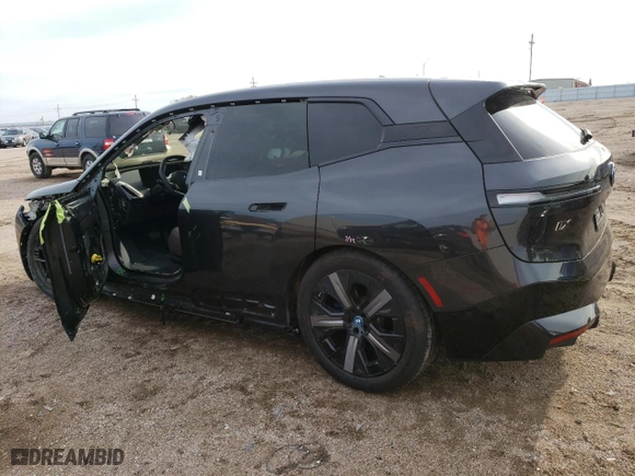 2023 BMW iX M60 with VIN WB533CF03PCM65597, listed as a Copart auction lot 69608884 with 4,793 mi miles and Salvage Title. Bid and sale history available at carsss.com. Image 2.