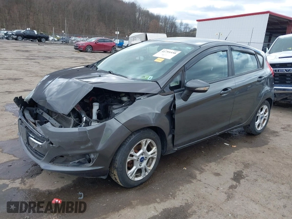 2015 Ford Fiesta SE with VIN 3FADP4EJ0FM117739, listed as a IAAI auction lot 41795558 with 111,000 mi miles. Bid and sale history available at carsss.com. Image 2.