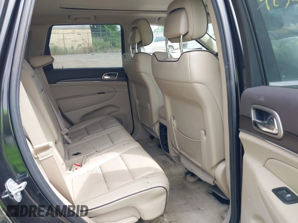 2015 Jeep Grand Cherokee Overland z VIN 1C4RJFCG3FC753772, wystawiony jako IAAI lot #42357411 z przebiegiem 130 970 mil mil oraz . Historia ofert i sprzedaży dostępna na DreamBid. Obrazek 8.