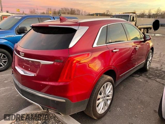 2019 Cadillac XT5 Premium Luxury AWD with VIN 1GYKNFRS2KZ251595, listed as a Copart auction lot 76847104 with 23,925 mi miles and Salvage title. Bid and sale history available at DreamBid. Image 4.
