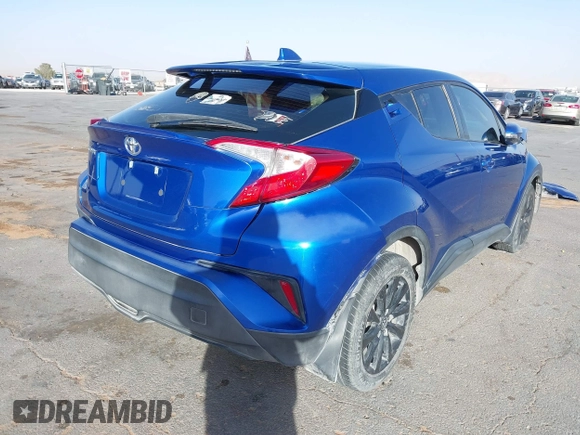 2019 Toyota C-HR XLE with VIN NMTKHMBX3KR098510, listed as a IAAI auction lot 41289899 with 112,981 mi miles. Bid and sale history available at carsss.com. Image 4.