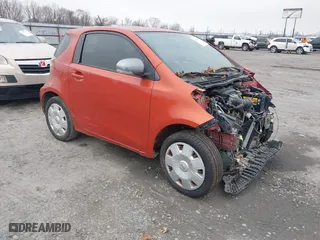 2012 Scion iQ with VIN JTNJJXB03CJ021023, listed as a IAAI auction lot 41487646 with 143,735 mi miles. Bid and sale history available at carsss.com. Image 1.