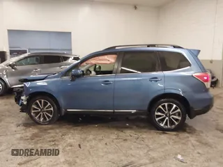 2017 Subaru Forester Touring with VIN JF2SJGTC9HH410251, listed as a IAAI auction lot 41411079 with 131,220 mi miles and . Bid and sale history available at DreamBid. Image 14.