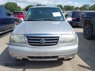 2003 Suzuki XL7 Touring z VIN JS3TY92V934101118, wystawiony jako IAAI lot #42425129 z przebiegiem 175 455 mil mil oraz . Historia ofert i sprzedaży dostępna na DreamBid. Obrazek 6.