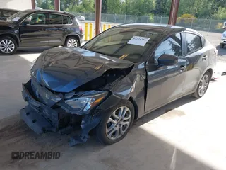 2016 Scion iA z VIN 3MYDLBZV4GY103085, wystawiony jako IAAI lot #42224286 z przebiegiem 90 786 mil mil oraz . Historia ofert i sprzedaży dostępna na DreamBid. Obrazek 2.
