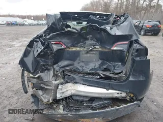2022 Tesla Model Y Long Range with VIN 7SAYGDEE5NA016892, listed as a IAAI auction lot 41936735 with 69,136 mi miles and . Bid and sale history available at carsss.com. Image 19.