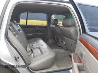 1999 Cadillac DeVille z VIN 1G6KD54Y6XU734741, wystawiony jako IAAI lot #42121114 z przebiegiem 152 829 mil mil oraz . Historia ofert i sprzedaży dostępna na DreamBid. Obrazek 8.