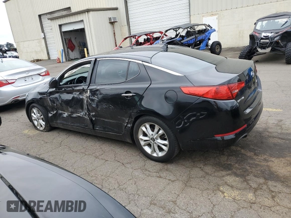 2011 Kia Optima EX with VIN KNAGN4A66B5085486, listed as a Copart auction lot 76928424 with 153,610 mi miles and Salvage Title. Bid and sale history available at carsss.com. Image 2.