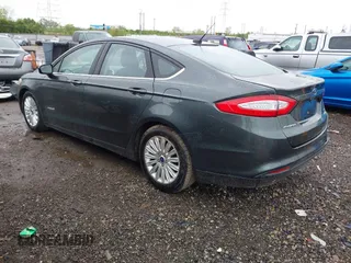 2015 Ford Fusion SE Hybrid with VIN 3FA6P0LU9FR184907, listed as a IAAI auction lot 42119737 with 153,255 mi miles and . Bid and sale history available at DreamBid. Image 3.