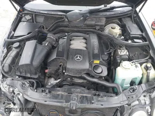 2000 Mercedes-Benz E-Class with VIN WDBJH65J5YB097275, listed as a IAAI auction lot 41879679 with 177,093 mi miles. Bid and sale history available at carsss.com. Image 10.