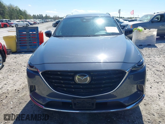 2021 Mazda CX-9 Carbon Edition with VIN JM3TCADY9M0517174, listed as a IAAI auction lot 41871485 with 48,484 mi miles and . Bid and sale history available at DreamBid. Image 13.