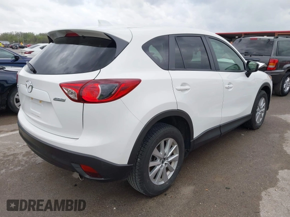 2015 Mazda CX-5 Touring with VIN JM3KE2CY3F0550624, listed as a IAAI auction lot 41931268 with 51,588 mi miles and . Bid and sale history available at carsss.com. Image 4.