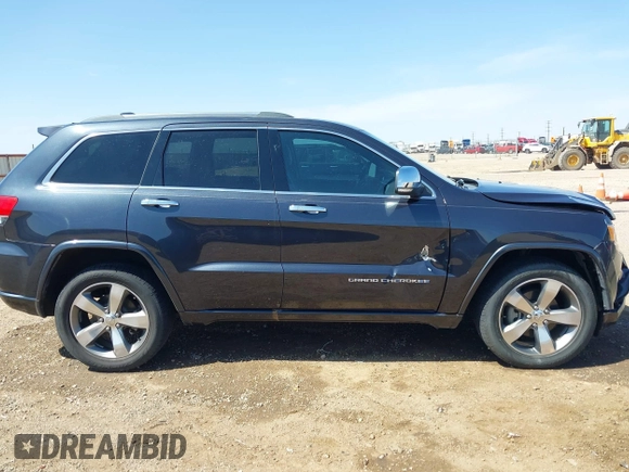 2015 Jeep Grand Cherokee Overland with VIN 1C4RJECG3FC635327, listed as a IAAI auction lot 41910559 with 118,519 mi miles and . Bid and sale history available at DreamBid. Image 13.