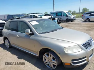 2004 Volkswagen Touareg with VIN WVGCM67L44D033856, listed as a IAAI auction lot 42142143 with 105,682 mi miles and . Bid and sale history available at DreamBid. Image 6.