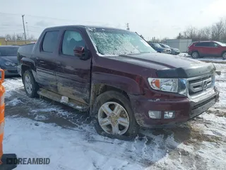 2011 Honda Ridgeline RTL with VIN 5FPYK1F58BB004573, listed as a IAAI auction lot 41576676 with 56,120 mi miles. Bid and sale history available at carsss.com. Image 1.