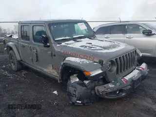 2021 Jeep Gladiator Rubicon z VIN 1C6JJTBG7ML516736, wystawiony jako IAAI lot #41106525 z przebiegiem 49 208 mil mil oraz . Historia ofert i sprzedaży dostępna na DreamBid. Obrazek 1.