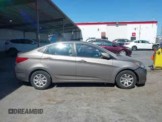 2014 Hyundai Accent GLS z VIN KMHCT4AE9EU671748, wystawiony jako IAAI lot #42356469 z przebiegiem 179 390 mil mil oraz . Historia ofert i sprzedaży dostępna na DreamBid. Obrazek 13.