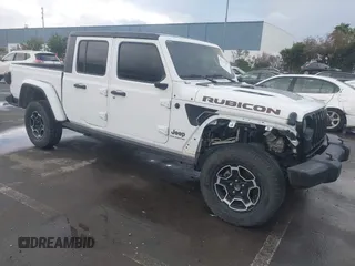 2023 Jeep Gladiator Rubicon FarOut z VIN 1C6JJTBM0PL593720, wystawiony jako IAAI lot #41529177 z przebiegiem 11 265 mil mil oraz . Historia ofert i sprzedaży dostępna na DreamBid. Obrazek 1.
