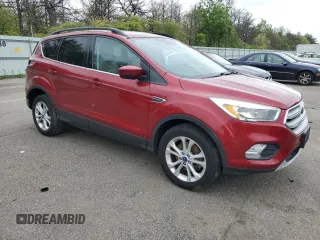 2018 Ford Escape SE z VIN 1FMCU9GD7JUB01668, wystawiony jako Copart lot #57038675 z przebiegiem 70 780 mil mil oraz Szkoda całkowita • Salvage title. Historia ofert i sprzedaży dostępna na DreamBid. Obrazek 4.