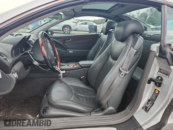 2005 Mercedes-Benz SL 500 with VIN WDBSK75F65F093215, listed as a Copart auction lot 63744135 with 94,645 mi miles and Salvage title. Bid and sale history available at DreamBid. Image 7.