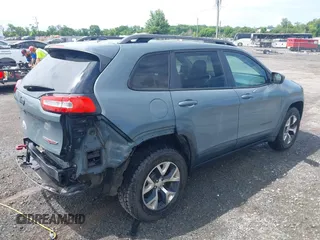 2014 Jeep Cherokee Trailhawk z VIN 1C4PJMBS4EW236950, wystawiony jako IAAI lot #42636128 z przebiegiem 170 491 mil mil oraz . Historia ofert i sprzedaży dostępna na DreamBid. Obrazek 4.