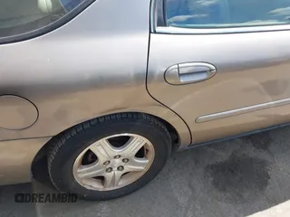 2002 Ford Taurus z VIN 1FAHP59U52G115825, wystawiony jako IAAI lot #41904552 z przebiegiem 91 004 mil mil oraz . Historia ofert i sprzedaży dostępna na DreamBid. Obrazek 6.