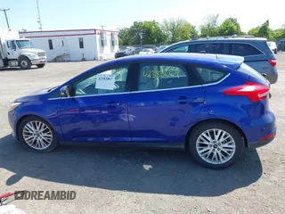 2015 Ford Focus Titanium z VIN 1FADP3N25FL291844, wystawiony jako IAAI lot #42383067 z przebiegiem 82 545 mil mil oraz . Historia ofert i sprzedaży dostępna na DreamBid. Obrazek 14.