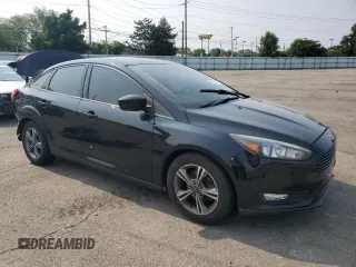 2018 Ford Focus SE z VIN 1FADP3F2XJL228407, wystawiony jako Copart lot #59254415 z przebiegiem 75 241 mil mil oraz Szkoda całkowita • Salvage title. Historia ofert i sprzedaży dostępna na DreamBid. Obrazek 4.