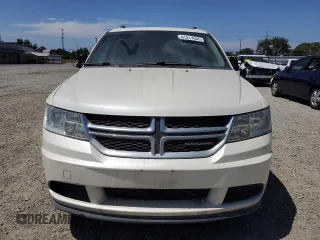 2013 Dodge Journey American Value with VIN 3C4PDCAB2DT547459, listed as a Copart auction lot 61217605 with 116,740 mi miles and Clean title. Bid and sale history available at DreamBid. Image 5.