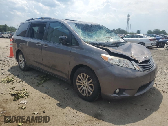2015 Toyota Sienna XLE with VIN 5TDYK3DC6FS576670, listed as a Copart auction lot 62612345 with 106,475 mi miles and Salvage title. Bid and sale history available at DreamBid. Image 4.