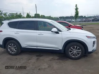 2019 Hyundai Santa Fe SE with VIN 5NMS23AD7KH111542, listed as a IAAI auction lot 42430502 with 78,755 mi miles and . Bid and sale history available at DreamBid. Image 13.