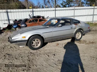 1983 Datsun 280ZX z VIN JN1HZ04S6DX571982, wystawiony jako Copart lot #86317294 z przebiegiem Nie podano mil oraz Tytuł czysty. Historia ofert i sprzedaży dostępna na DreamBid. Obrazek 1.