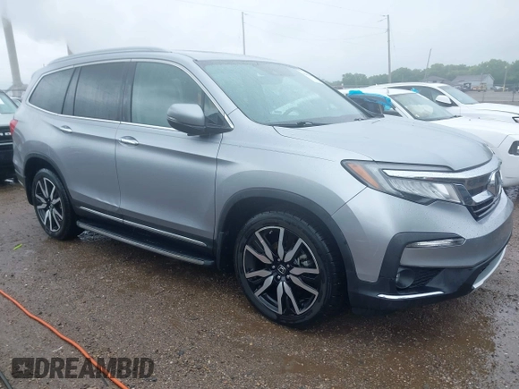 2019 Honda Pilot Touring 8-Passenger with VIN 5FNYF6H98KB097105, listed as a IAAI auction lot 42353009 with 133,212 mi miles and . Bid and sale history available at DreamBid. Image 1.