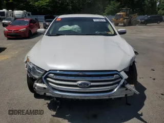 2015 Ford Taurus SEL z VIN 1FAHP2E82FG108442, wystawiony jako Copart lot #57790515 z przebiegiem 116 834 mil mil oraz Szkoda całkowita • Salvage title. Historia ofert i sprzedaży dostępna na DreamBid. Obrazek 5.