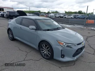 2014 Scion tC z VIN JTKJF5C71E3081033, wystawiony jako IAAI lot #42333111 z przebiegiem 144 124 mil mil oraz . Historia ofert i sprzedaży dostępna na DreamBid. Obrazek 1.