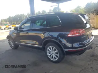 2017 Volkswagen Touareg Sport with VIN WVGEF7BP8HD000237, listed as a Copart auction lot 52714074 with 107,463 mi miles and . Bid and sale history available at DreamBid. Image 2.