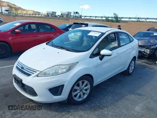 2012 Ford Fiesta SE with VIN 3FADP4BJ7CM102932, listed as a IAAI auction lot 41760394 with 70,394 mi miles and . Bid and sale history available at carsss.com. Image 2.
