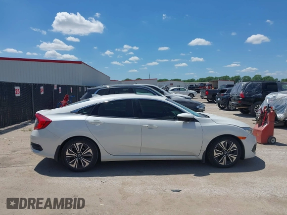 2018 Honda Civic EX-T z VIN JHMFC1F3XJX001723, wystawiony jako IAAI lot #42228776 z przebiegiem 97 432 mil mil oraz . Historia ofert i sprzedaży dostępna na DreamBid. Obrazek 13.