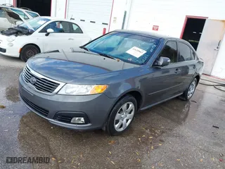 2009 Kia Optima LX with VIN KNAGE228495311622, listed as a IAAI auction lot 41628803 with 1 mi miles. Bid and sale history available at carsss.com. Image 2.