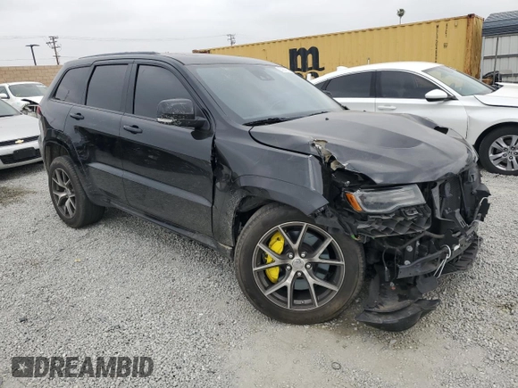 2017 Jeep Grand Cherokee SRT with VIN 1C4RJFDJ1HC904654, listed as a Copart auction lot 55954124 with 82,507 mi miles and Salvage Title. Bid and sale history available at carsss.com. Image 4.