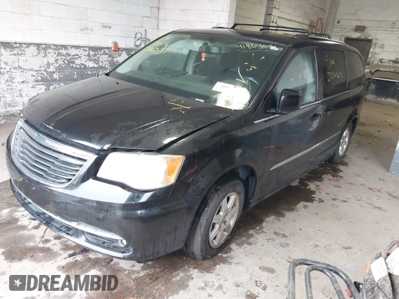 2011 Chrysler Town & Country Touring with VIN 2A4RR5DGXBR745293, listed as a IAAI auction lot 41862089 with 999,999 mi miles. Bid and sale history available at carsss.com. Image 2.