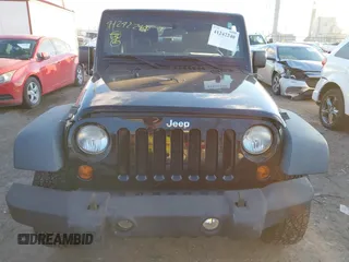 2011 Jeep Wrangler Rubicon with VIN 1J4HA6D11BL564211, listed as a IAAI auction lot 41242240 with 124,039 mi miles and . Bid and sale history available at carsss.com. Image 12.