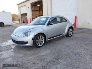 2012 Volkswagen Beetle 2.5L PZEV with VIN 3VWJP7AT9CM602606, listed as a IAAI auction lot 41503442 with 1 mi miles. Bid and sale history available at carsss.com. Image 2.