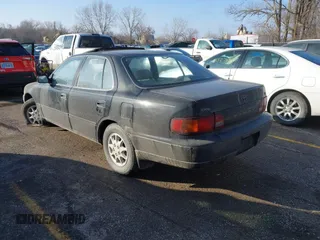 1996 Toyota Camry DX with VIN JT2BG12KXT0407961, listed as a IAAI auction lot 41511138 with 266,781 mi miles. Bid and sale history available at carsss.com. Image 3.