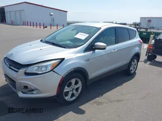 2013 Ford Escape SEL with VIN 1FMCU9H99DUA74813, listed as a IAAI auction lot 42070945 with 187,417 mi miles and . Bid and sale history available at DreamBid. Image 2.